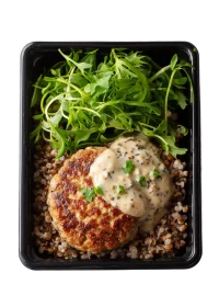 Homemade cutlet in a creamy sauce with kimchi, buckwheat and green salad