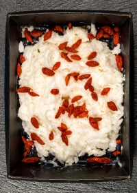 Rice porridge with coconut milk and goji berries