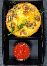 Frittata with mushrooms and tomato sauce
