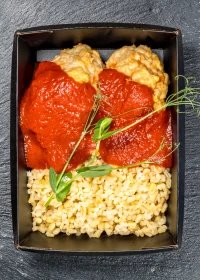Meat patties in tomato sauce with bulgur