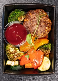 beef steak with roasted vegetables and cranberry sauce