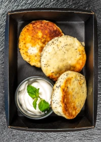 cottage cheese pancakes with poppy seeds and sour cream