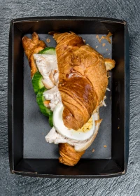 croissant with egg and chicken fillet